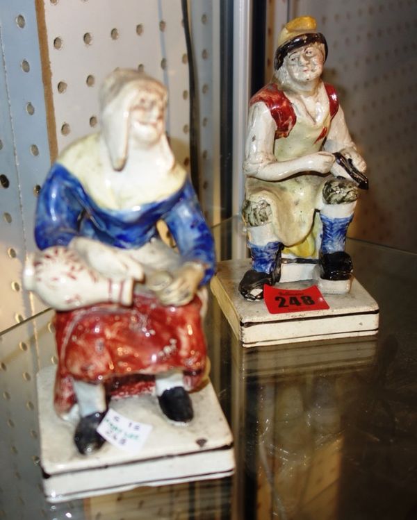 A pair of Staffordshire pearlware figures of a man and woman. (2)