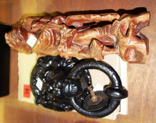 A group of collectables including; A Victorian lion mask door knocker, a Chinese hardwood carved figure and two albums woodblock prints. (qty)