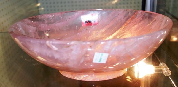 A group of rose quartz, including three rectangular stands and a pedestal oval bowl. (4)