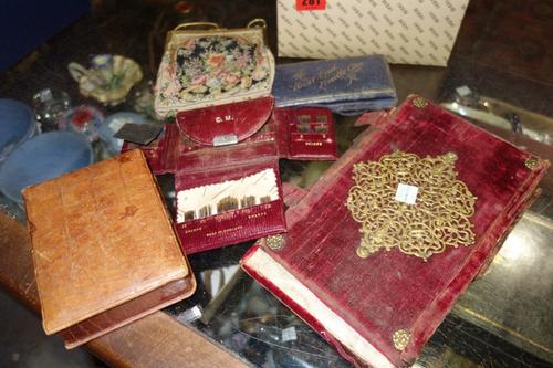 An 18th century gilt metal mounted book binding, a beadwork bag and a group of needlework cases. (qty)