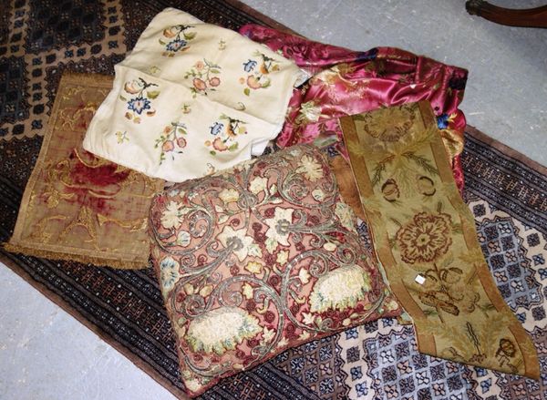 A small group of silk brocades, needlework panels and cushions. (qty)