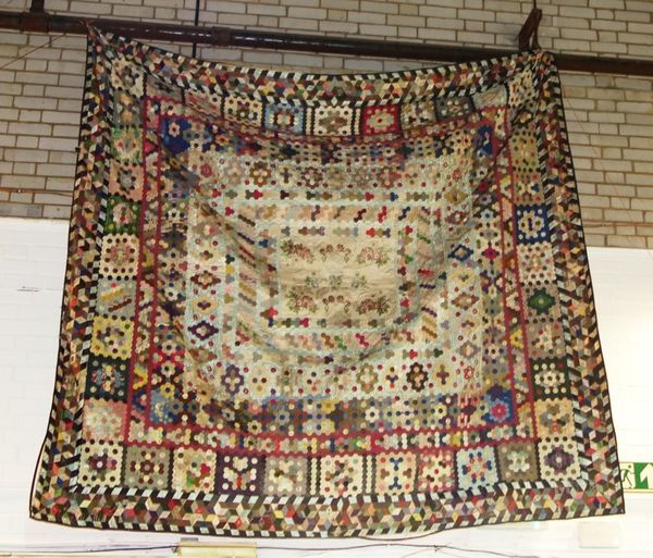 A large silk patchwork quilt.