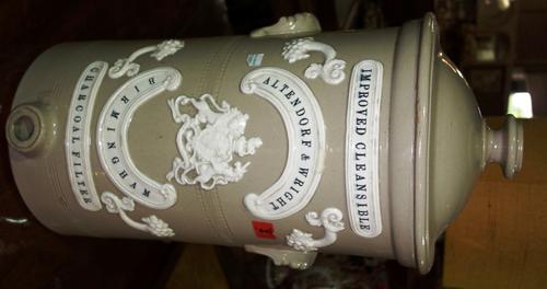 A stoneware water filter, 19th century, by Altendorf and Wright, Birmingham, 54cm high. (1)
