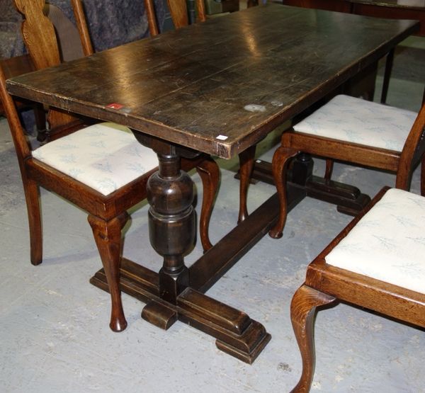 A 20th century oak rectangular trestle type dining table, 67cm x 136cm.