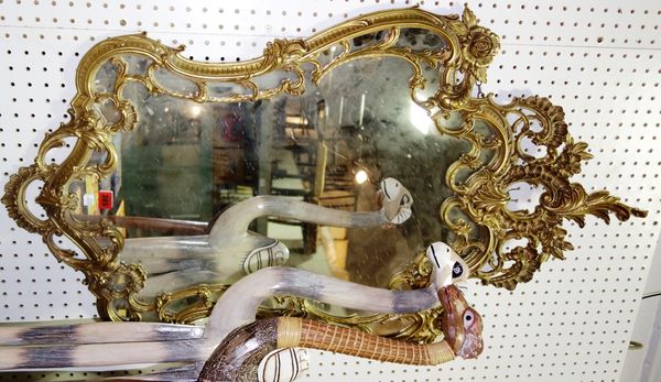 A gilt metal wall mirror with acanthus moulded decoration, 67cm wide x 111cm high.