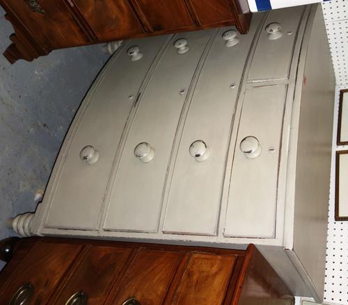 A 19th century bowfront grey painted chest of two short and three long graduated drawers, 104cm wide.