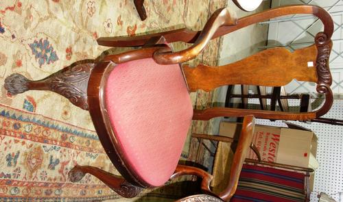 A set of six 20th century walnut vase back dining chairs, to include pair of carvers.  (6)
