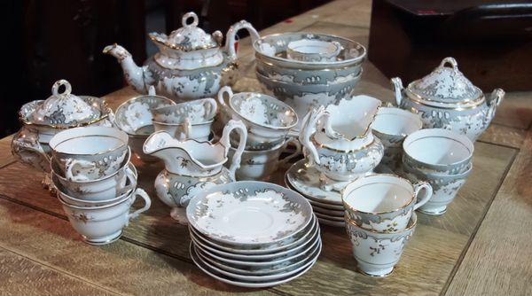 A Ridgway composite grey and gilt part tea and coffee service, circa 1840-50, comprising; a teapot and cover, two sucriers and covers, two milk jugs,