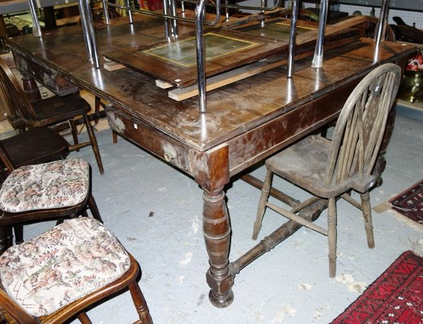 A large 20th century rectangular oak dining table, with turned supports and an 'H' frame stretcher, 202cm x 135cm.