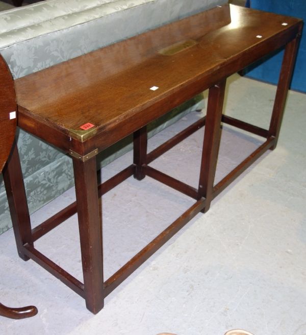 A mahogany rectangular brass bound side table, 137cm wide.