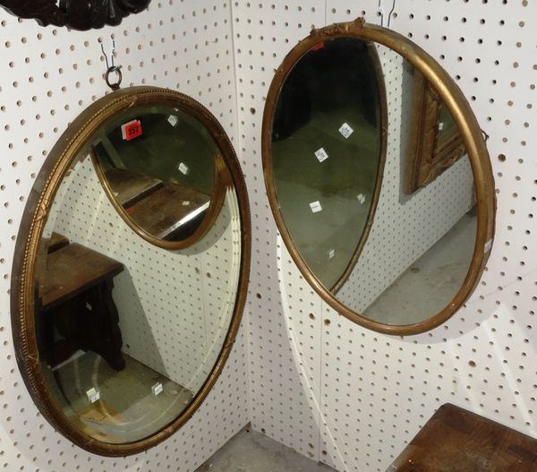 A 19th century oval gilt wall mirror and another, larger 52cm x 67cm. (2)