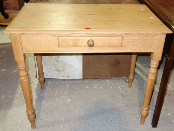 A rectangular pine writing table with single drawer,91cm wide.
