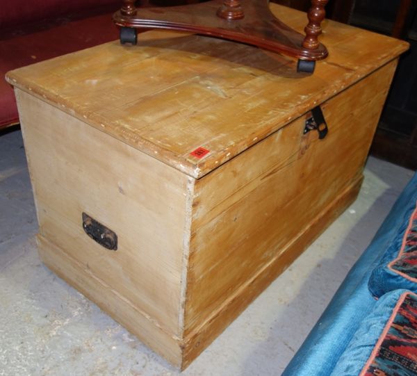 A rectangular pine lift top trunk with iron handles, 95cm wide.