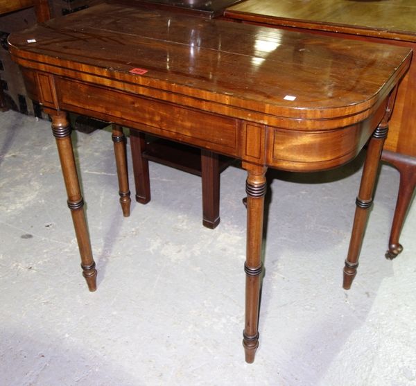 A 19th century mahogany and ebony strung foldover card table, 91cm wide.