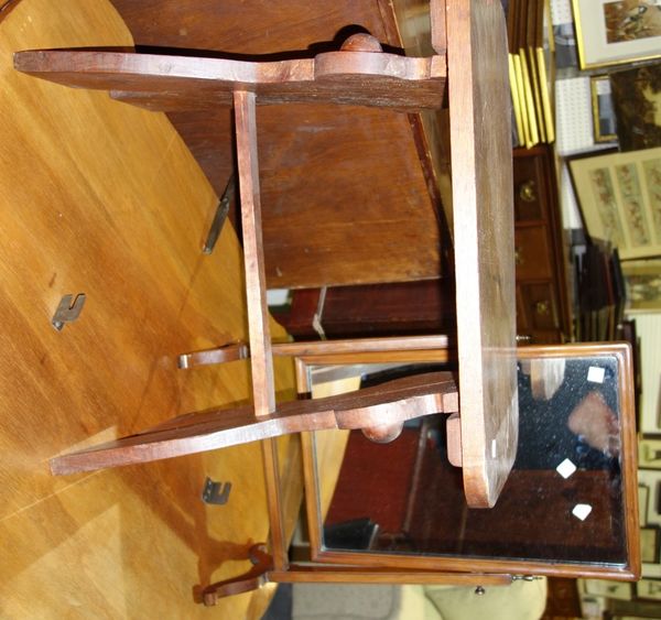 A 20th century oak trestle type stool and a toilet mirror. (2)
