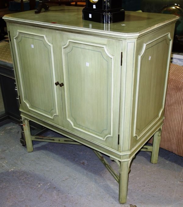 A 20th century green painted two door side cabinet on square supports, 96cm wide.