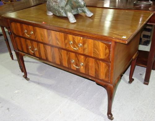 An early 20th century mahogany chest with two satinwood banded long drawers on slender cabriole supports, stamped Maples, 122cm wide.
