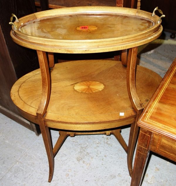 An Edwardian mahogany and box strung two tier oval table with glass bottom lift off twin handled tray, 76cm.