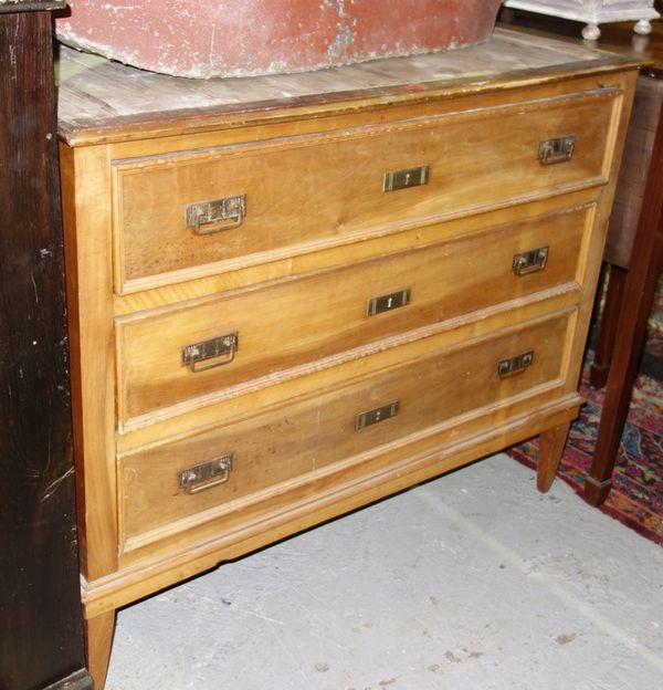 A 19th century French birch chest of three long drawers on tapering square supports, marble top lacking, 113cm wide.