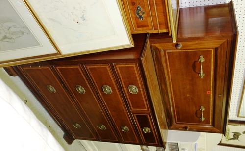 An Edwardian mahogany and satinwood banded clothes press/chest of drawers, with maker's plaque 'Maple & Co'., 105cm wide.