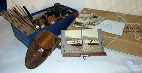 A quantity of collectables, including a stereoscopic viewer and slides, binoculars, opera glasses and a quantity of cigarette cards. (qty)
