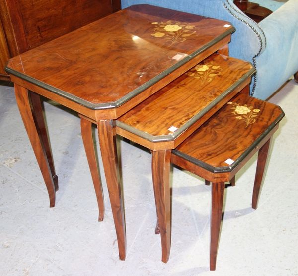 A 20th century walnut nest of three tables with floral inlaid decoration, the larger 65cm wide.  (3)