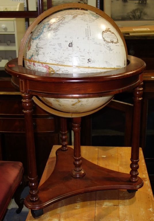 A 20th century terrestrial globe on a mahogany stand.