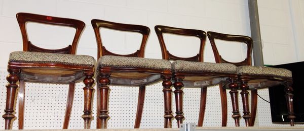 A set of four Victorian mahogany balloon back dining chairs. (4)