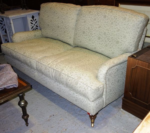 A large 20th century green upholstered oak framed double humpback sofa, 170cm wide.
