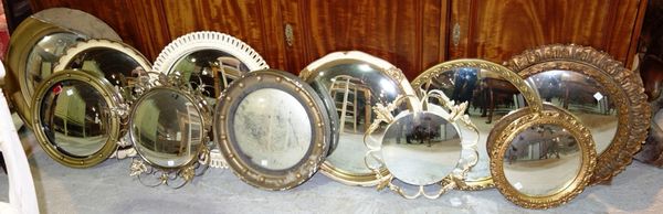 A group of eleven various 20th century convex wall mirrors (a.f). (11)