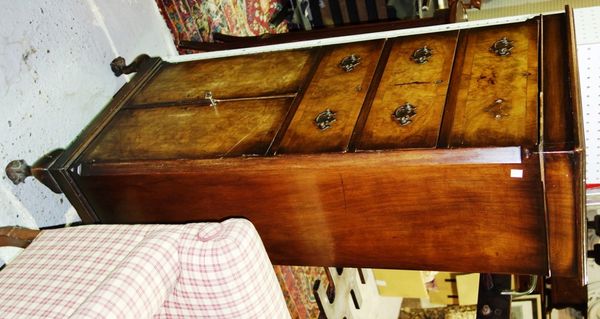 A mid 20th century slim walnut chest of three drawers over cupboards, 52cm wide.