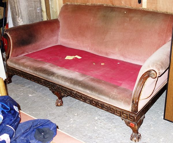 A 20th century mahogany framed sofa on ball and claw feet, lacking cushions, 175cm wide.