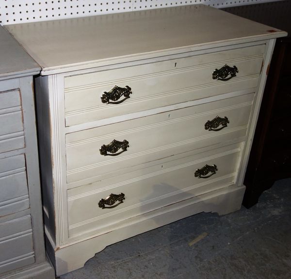 A white painted chest of three long drawers, 92cm wide.