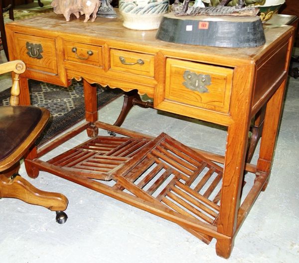 An Oriental softwood pedestal type desk, 114cm wide.