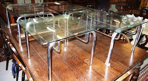 A set of four 20th century chrome and glass coffee tables. (4)
