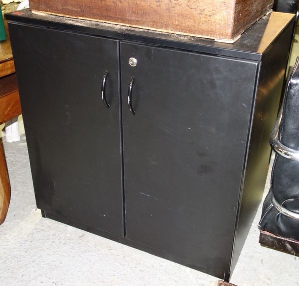 A pair of 20th century black painted two door cupboards, 76cm wide.