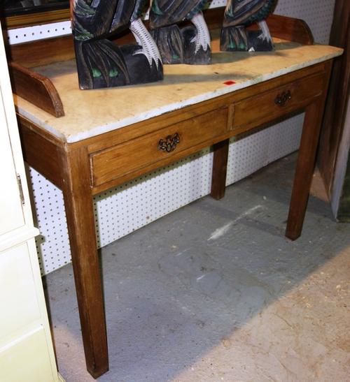 A 20th century pine rectangular washstand, with marble top and three quarter gallery and pair of drawers, 106cm wide.