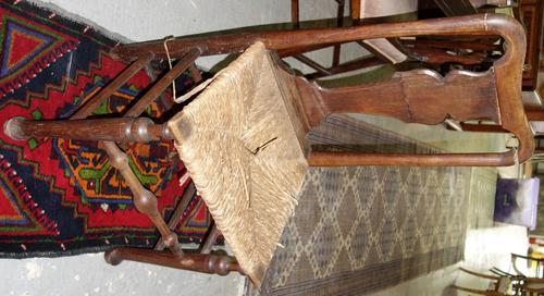 A set of four 19th century oak dining chairs with vase splats and rush seats. (4) (a.f)
