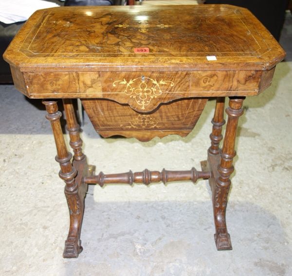 A Victorian walnut and inlaid sewing table.
