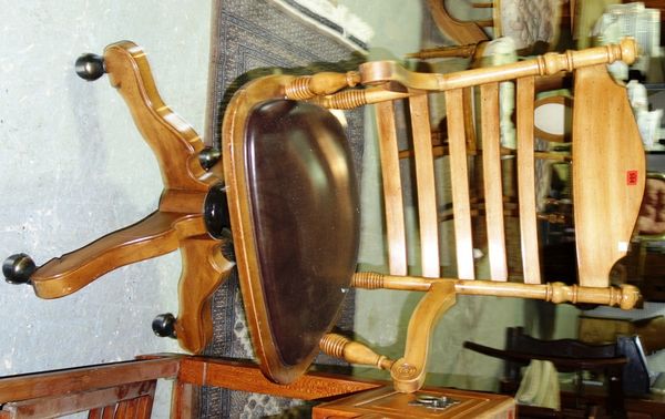 A 19th century walnut swivel chair with ladder back.