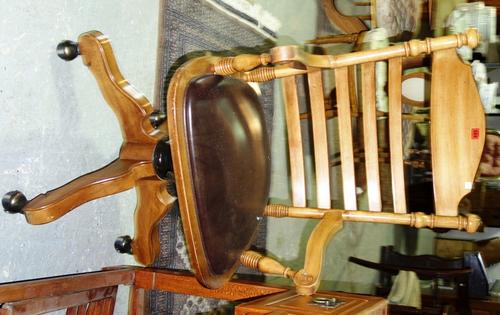 A 19th century walnut swivel chair with ladder back.