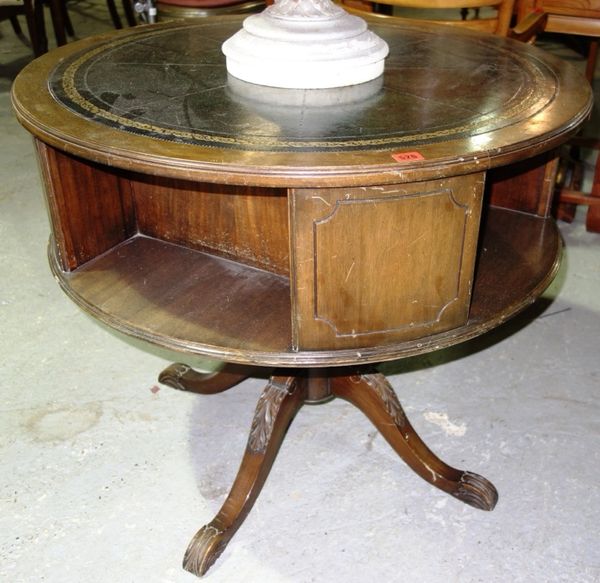 A 20th century mahogany circular drum table with green leather inset top, 85cm wide.