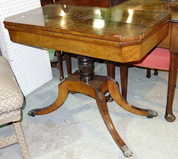 A 19th century rosewood fold over tea table with four outswept supports, 82cm wide.