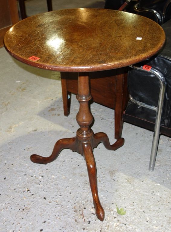 A 19th century oak circular tripod occasional table, 63cm wide.