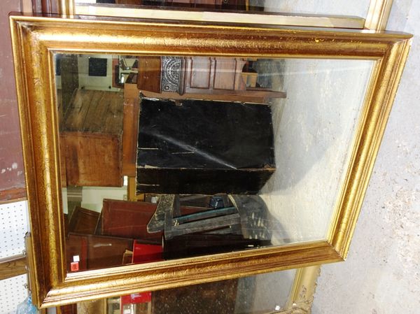 A 20th century gilt framed rectangular mirror with bevelled glass plate, 92cm x 149cm.
