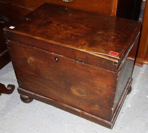 A 19th century elm lift top storage box, 51cm wide.