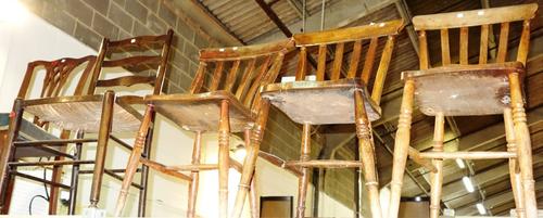 A set of three 19th century elm seated scullery chairs and an oak ladder back chair, (4).
