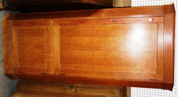 A 20th century oak floor standing corner cabinet, 71cm wide.