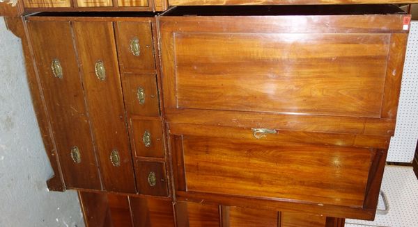 A 19th century mahogany linen press with pair of cupboard doors over four short and two long drawers, 106cm wide.