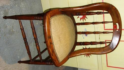 A pitch pine spindle back scullery chair together with a rectangular oak framed mirror. (2)